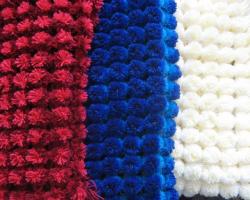 Blanket made of pompoms, three master class Bedspread on a frame with nails
