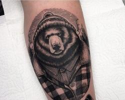 Значението на татуировка на мечка с усмивка